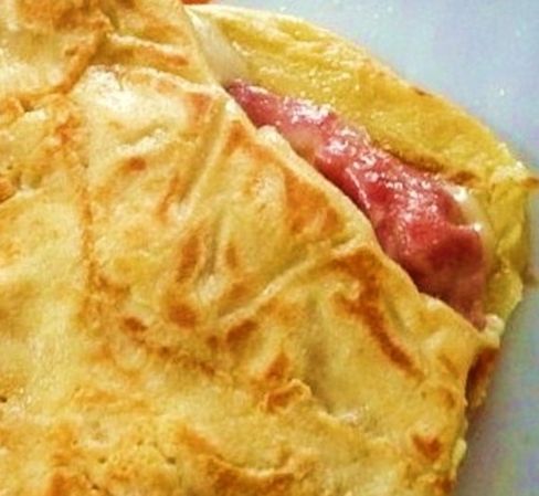 Crespelle con prosciutto e ricotta in besciamella